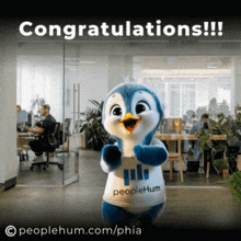 a penguin mascot is wearing a shirt that says " peoplehum "