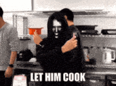 a man with a mask on his face is standing in a kitchen with the words let him cook written on the bottom