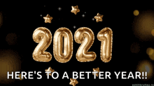 a new year 's greeting with gold balloons that say 2021 here 's to a better year