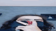 a woman is applying red lipstick to her lips with a brush .
