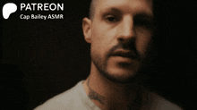 a close up of a man 's face with the words patreon cap bailey asmr below him