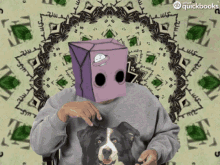 a man wearing a sweater with a dog on it and a purple box on his head