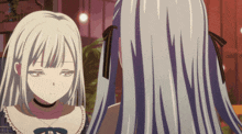 a girl with long white hair looks at herself in the mirror
