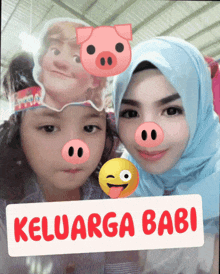 a picture of a woman and a child with a sign that says keluarga babi on it