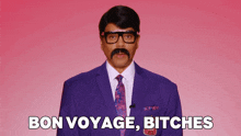 a man in a suit and tie with a mustache says bon voyage bitches