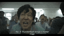 a man in a crowd says " no 6 thunderflash brings it home - yes "