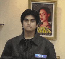 a young man wearing a name tag that says will
