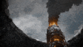 smoke is coming out of a very tall structure