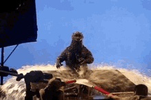 a monster is being sprayed with water by a man