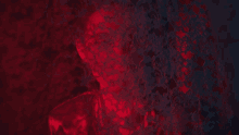 a red and black background with a few hearts on it