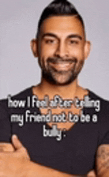a man with a beard is smiling while standing with his arms crossed and a quote .