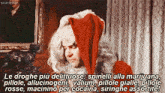 a man in a santa hat says scarlettar in the upper right corner