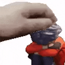 a person is holding a toy in their hands and making a funny face .