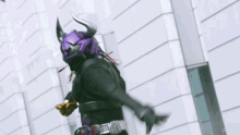 a person is wearing a purple belt with a gold buckle on it
