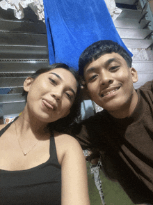 a man and a woman are posing for a picture together