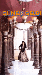 a woman in a long dress is dancing in a hallway with the words günes geldi written on the bottom