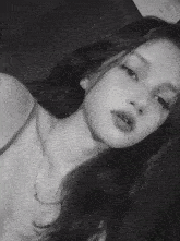 a black and white photo of a woman 's face