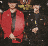two men standing next to each other with a sign in the background that says ' mercedes '