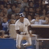 a baseball player in a white jersey with the letter s on it