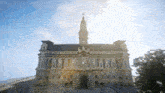 a large building with a cross on top of it
