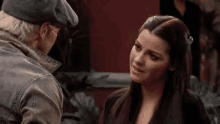 a man and woman are looking at each other