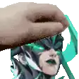 a hand is holding a picture of a person 's head with green eyes .