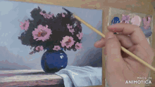 a painting of flowers in a blue vase is made in animoto