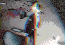 a pixelated image of a person with a rainbow of colors