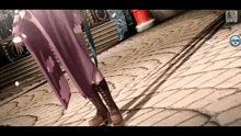 a woman in a purple coat is standing on a brick sidewalk with a santa claus decoration in the background