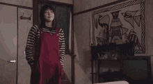 a person walking down a set of stairs next to a chair