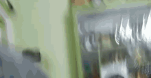 a blurred image of a refrigerator with a lot of food in it