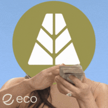a woman is holding a stack of money in front of a green circle with the word eco on it