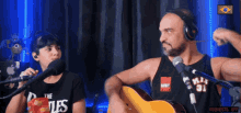 a man wearing headphones and a shirt that says the beatles