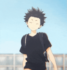 a boy in a black shirt is walking with a backpack on his shoulder .