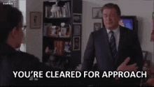 You'Re Cleared For Approach GIF - 30rock Hug Cleared For Approach GIFs