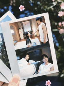 a polaroid picture of a man and woman in a bedroom