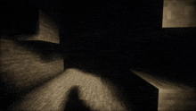 a man in a suit and tie is standing in a dark cave