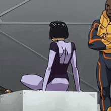 a woman in a purple and black suit sits on a white box