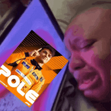 a man is looking at a picture of pole on a screen