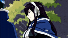a woman with long black hair and a blue cape stands next to a man