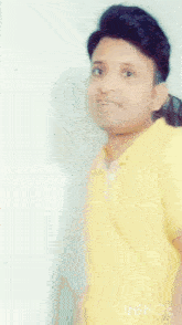 a person in a yellow shirt with the words inshot on the bottom right