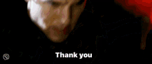 a blurry picture of a man and the words thank you