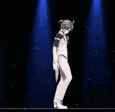 a person is dancing on a stage with a microphone .