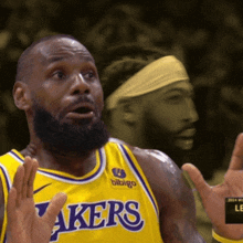 a man wearing a lakers jersey with a bibigo logo on the front