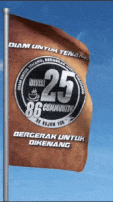 a flag with the number 25 on it is waving in the wind