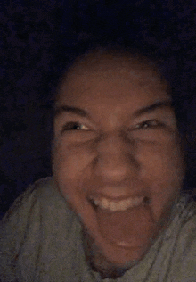 a close up of a person 's face with a funny face .