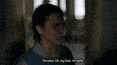 a woman in a blue shirt says i 'm sorry