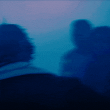 a blurry picture of a person in a dark room