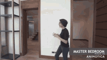 a woman stands in a room with the words master bedroom made in animotica on the bottom