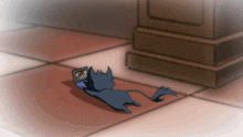 a cartoon of a cat laying on the floor with a laptop